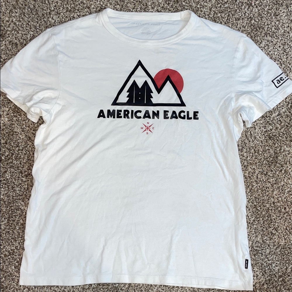American Eagle Outfitters White Tee with Black Mountain Logo and Red Sun